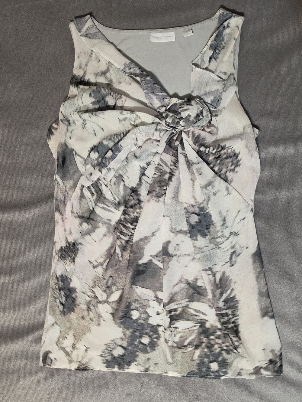 Gray and white abstract floral chiffon front sleeveless blouse. Stretchy